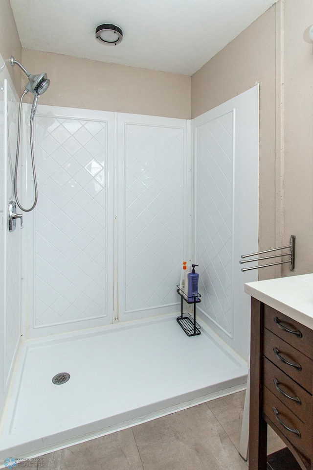 1513 40th Ave N, Moorhead, MN 56560 - bathroom with a tile shower, vanity, and tile patterned floors
