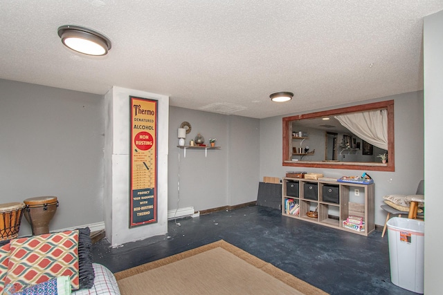 1513 40th Ave N, Moorhead, MN 56560 - game room featuring a textured ceiling, baseboards, concrete flooring, water heater, and a baseboard radiator