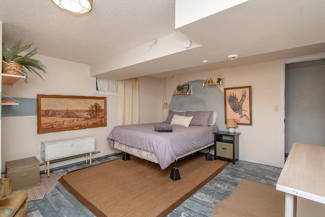 1513 40th Ave N, Moorhead, MN 56560 - bedroom with a textured ceiling, baseboard heating, and wood finished floors