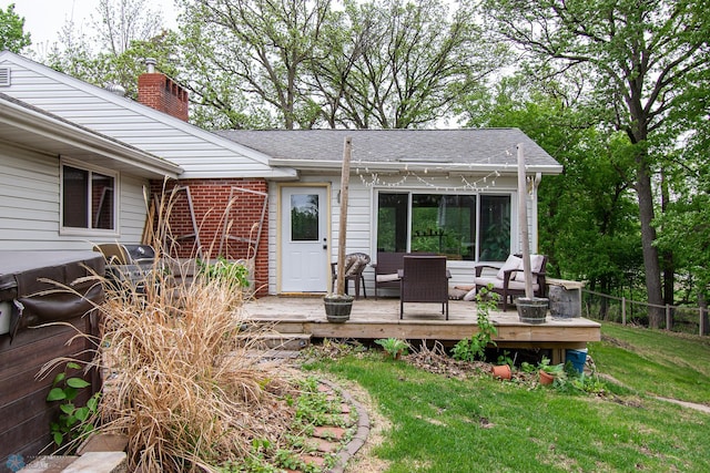 1513 40th Ave N, Moorhead, MN 56560 - exterior space with a chimney, a deck, brick siding, and roof with shingles