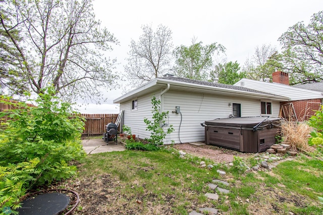 1513 40th Ave N, Moorhead, MN 56560 - rear view of property featuring a hot tub and a patio