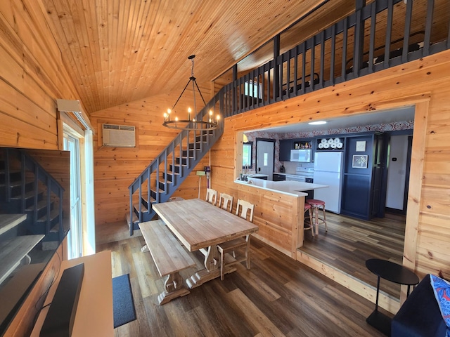 8137 Hoyt Ave SW, Victor Twp, MN 55349 - dining space with stairs, wooden walls, lofted ceiling, wood finished floors, and a wall mounted AC