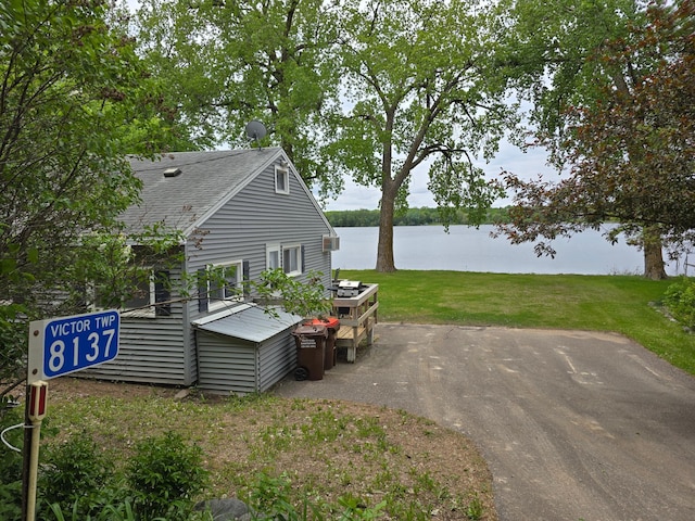 8137 Hoyt Ave SW, Victor Twp, MN 55349 - view of grassy yard featuring a water view