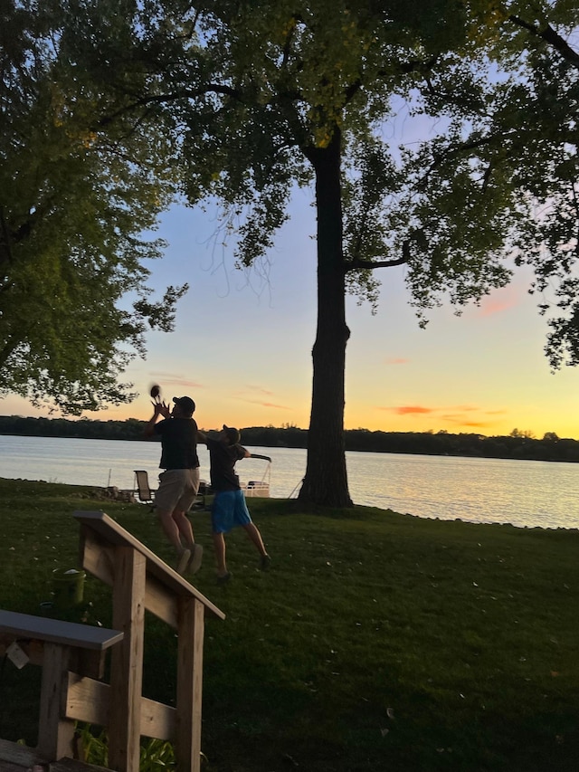 8137 Hoyt Ave SW, Victor Twp, MN 55349 - yard at dusk featuring a water view and a yard