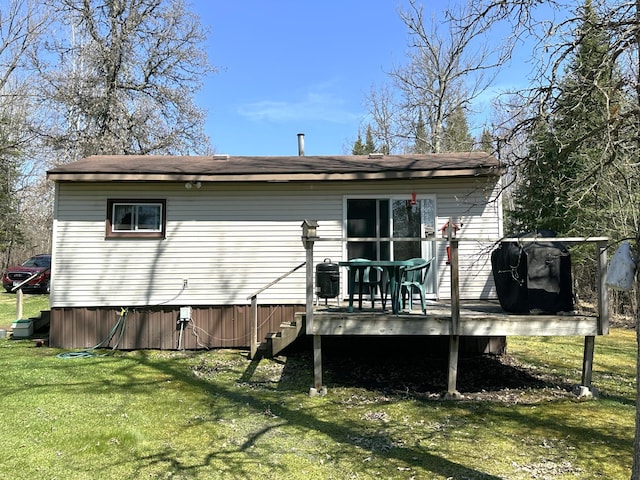 1529 Riddell Rd, Field Twp, MN 55723 - back of property with a wooden deck and a yard