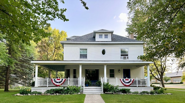 573 Rowland St, Tracy, MN 56175 - view of front of house with covered porch, a front yard, a chimney, and roof with shingles