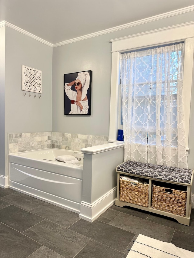 573 Rowland St, Tracy, MN 56175 - bathroom with a garden tub, ornamental molding, baseboards, and tile patterned flooring