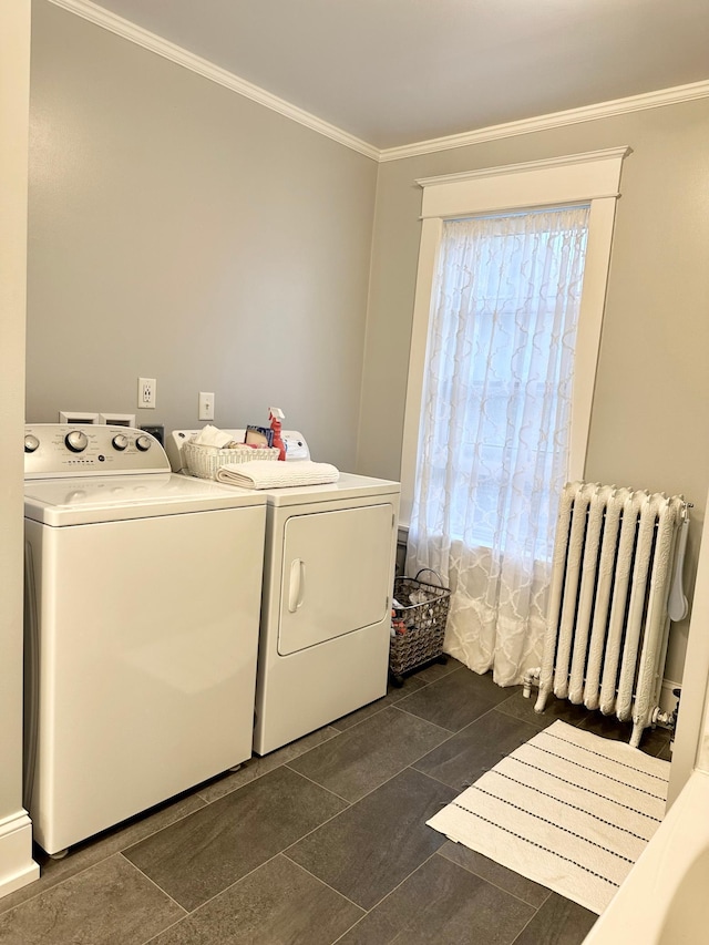 573 Rowland St, Tracy, MN 56175 - laundry room with radiator heating unit, independent washer and dryer, crown molding, and dark tile patterned flooring