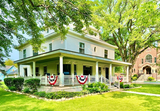 573 Rowland St, Tracy, MN 56175 - view of front of home with covered porch and a front lawn