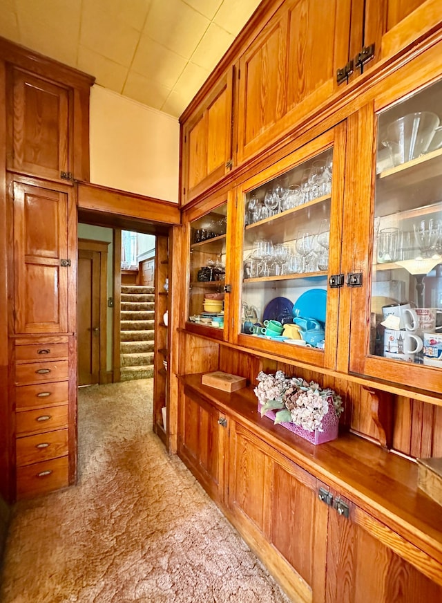 573 Rowland St, Tracy, MN 56175 - corridor with light colored carpet and stairway