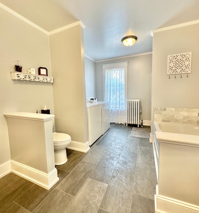 573 Rowland St, Tracy, MN 56175 - bathroom with radiator, washer and dryer, ornamental molding, toilet, and a bath