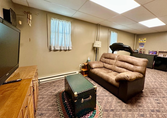 573 Rowland St, Tracy, MN 56175 - living room featuring a baseboard heating unit, a drop ceiling, and carpet floors