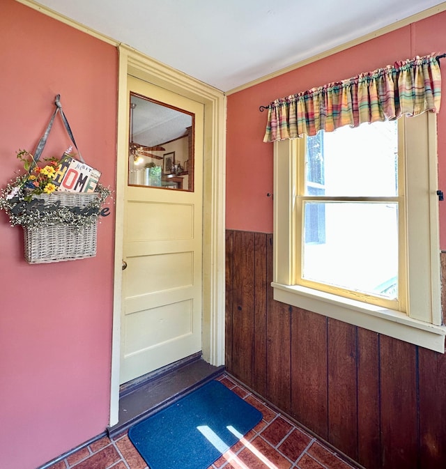 573 Rowland St, Tracy, MN 56175 - doorway featuring wainscoting