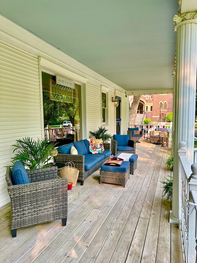 573 Rowland St, Tracy, MN 56175 - wooden porch with an outdoor living space with a fire pit