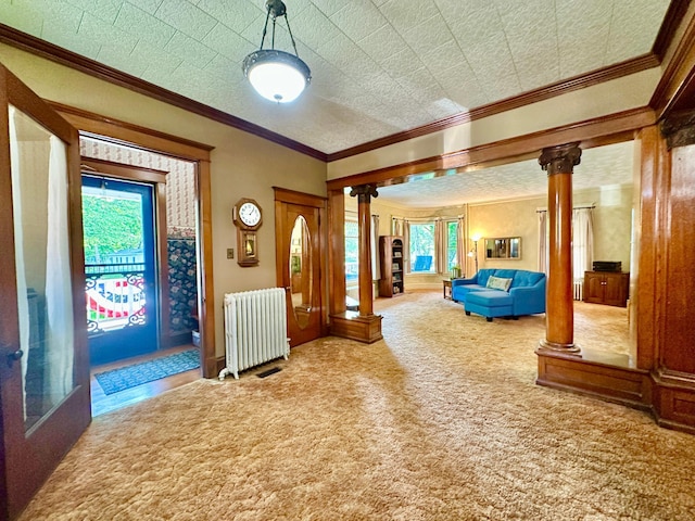 573 Rowland St, Tracy, MN 56175 - corridor with ornate columns, radiator, crown molding, and carpet floors