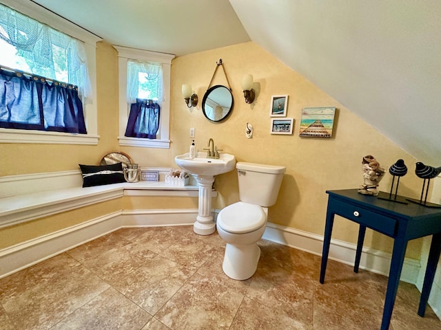 573 Rowland St, Tracy, MN 56175 - bathroom with lofted ceiling and toilet