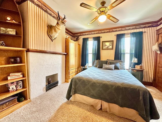 573 Rowland St, Tracy, MN 56175 - carpeted bedroom featuring ornamental molding, a fireplace, and a ceiling fan