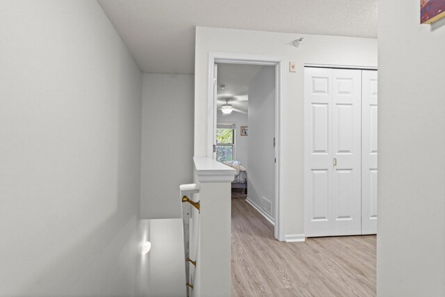 500 2nd St Unit 116, Minneapolis, MN 55401 - corridor featuring an upstairs landing, light wood-type flooring, and baseboards