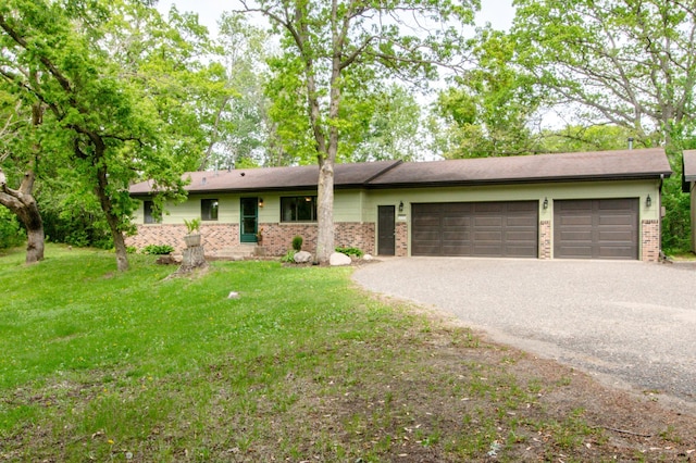 19715 Tyler St NW, Elk River, MN 55330 - ranch-style home featuring brick siding, an attached garage, driveway, and a front lawn