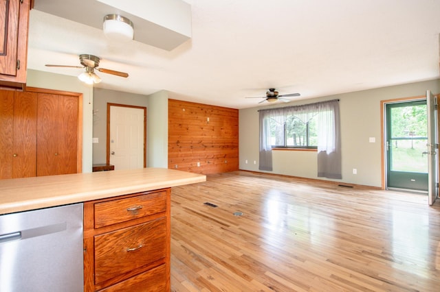 19715 Tyler St NW, Elk River, MN 55330 - kitchen with dishwasher, a ceiling fan, light wood finished floors, light countertops, and brown cabinetry