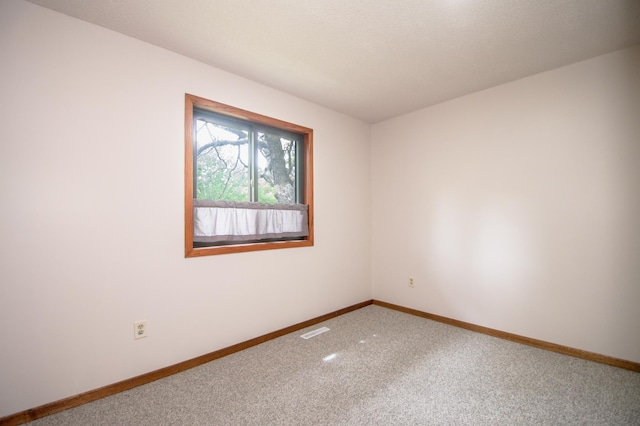 19715 Tyler St NW, Elk River, MN 55330 - carpeted empty room featuring baseboards