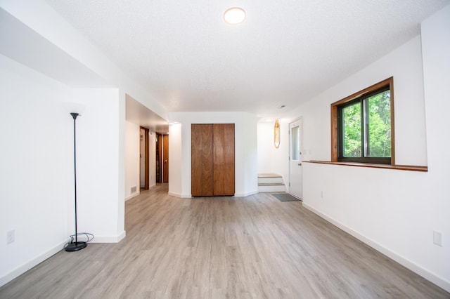19715 Tyler St NW, Elk River, MN 55330 - spare room with light wood-style floors and baseboards