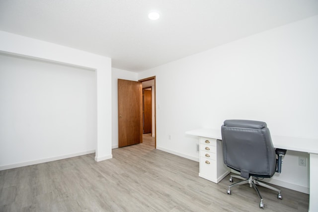 19715 Tyler St NW, Elk River, MN 55330 - home office with light wood finished floors and baseboards