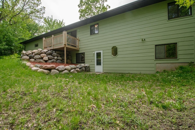 19715 Tyler St NW, Elk River, MN 55330 - rear view of property with a lawn and a balcony