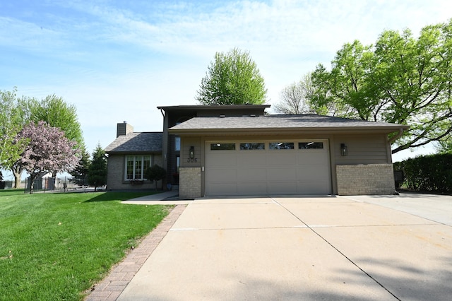 306 Windcrest Ln SE, New Prague, MN 56071 - view of front of property with brick siding, a chimney, driveway, and an attached garage