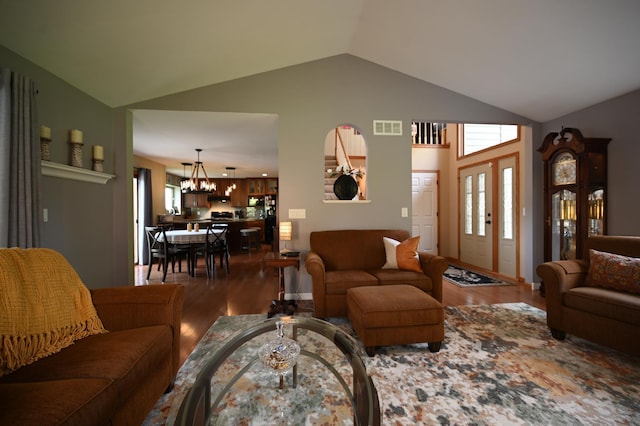 306 Windcrest Ln SE, New Prague, MN 56071 - living room with wood finished floors, vaulted ceiling, and a chandelier