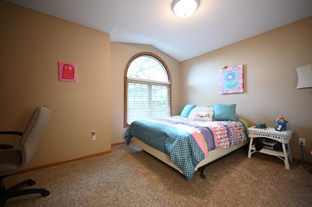 306 Windcrest Ln SE, New Prague, MN 56071 - carpeted bedroom featuring lofted ceiling and baseboards