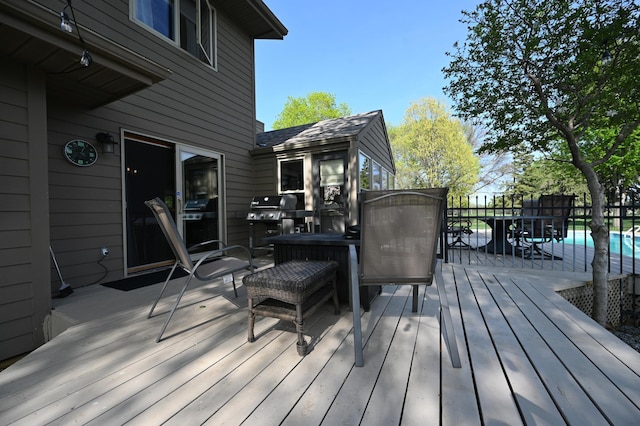 306 Windcrest Ln SE, New Prague, MN 56071 - wooden terrace with outdoor dining area and a grill