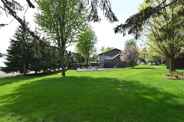 306 Windcrest Ln SE, New Prague, MN 56071 - view of green lawn with a swimming pool