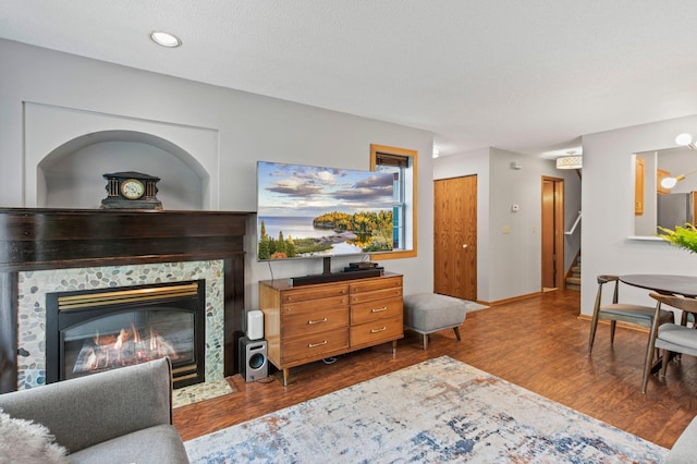 1925 Shenandoah Ct Unit F, Plymouth, MN 55447 - living area featuring wood finished floors, stairs, and a tiled fireplace