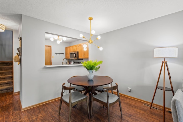 1925 Shenandoah Ct Unit F, Plymouth, MN 55447 - dining space with stairs, baseboards, dark wood-type flooring, a chandelier, and a textured ceiling