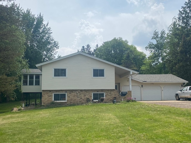 1550 181st Ave NW, Andover, MN 55011 - view of front of house featuring an attached garage, driveway, a front yard, and brick siding