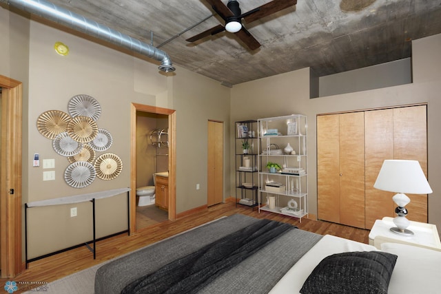 210 11th St N Unit 202, Fargo, ND 58102 - bedroom featuring wood finished floors and connected bathroom