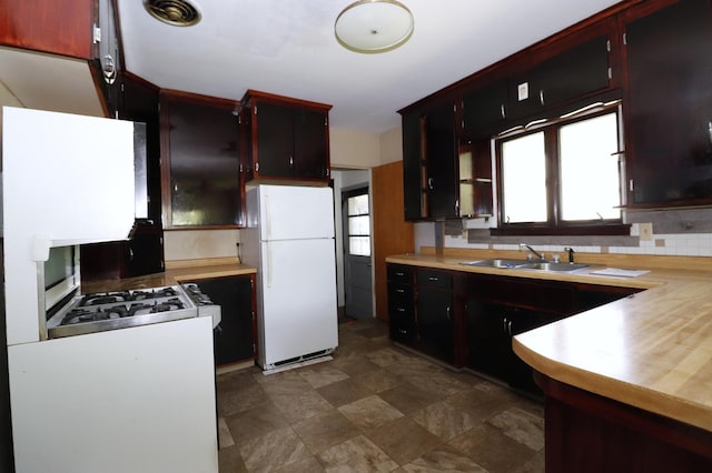 718 1st St SW, Faribault, MN 55021 - kitchen with freestanding refrigerator, a sink, and light countertops