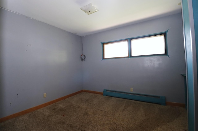 718 1st St SW, Faribault, MN 55021 - unfurnished room with baseboard heating, carpet floors, and baseboards
