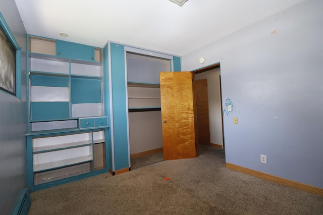 718 1st St SW, Faribault, MN 55021 - unfurnished bedroom with baseboard heating, carpet flooring, baseboards, and a closet