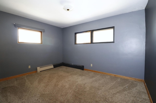 718 1st St SW, Faribault, MN 55021 - carpeted spare room with baseboards and a baseboard heating unit