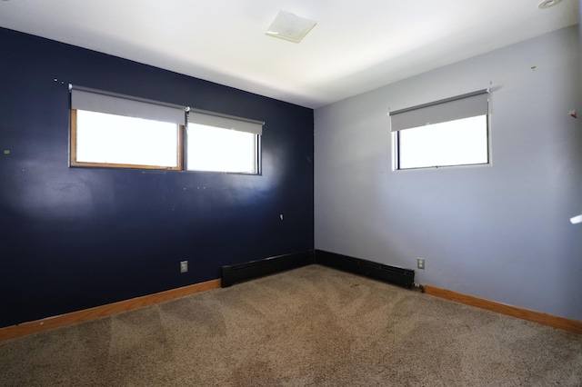 718 1st St SW, Faribault, MN 55021 - carpeted spare room with plenty of natural light and baseboards