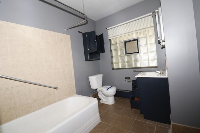 718 1st St SW, Faribault, MN 55021 - bathroom featuring toilet, vanity, tile patterned floors, and shower / tub combination