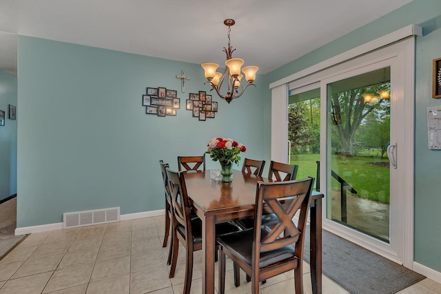 830 Halliday Rd, Saint Cloud, MN 56301 - dining area featuring a chandelier, baseboards, and light tile patterned floors