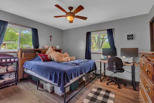830 Halliday Rd, Saint Cloud, MN 56301 - bedroom with light wood-style floors, a desk, and a ceiling fan