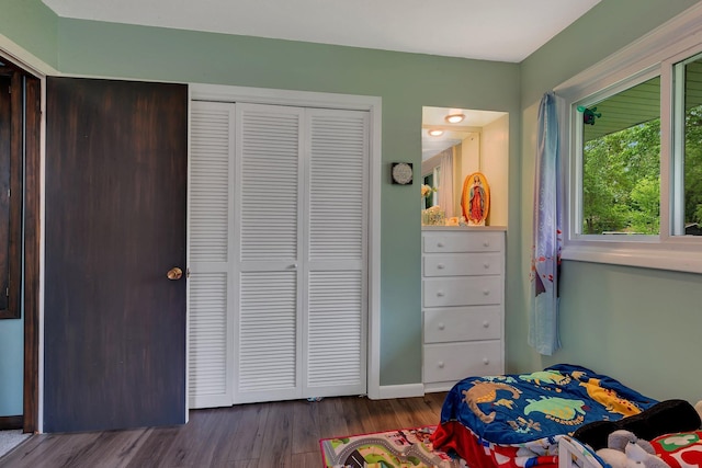 830 Halliday Rd, Saint Cloud, MN 56301 - bedroom with a closet, wood finished floors, and baseboards