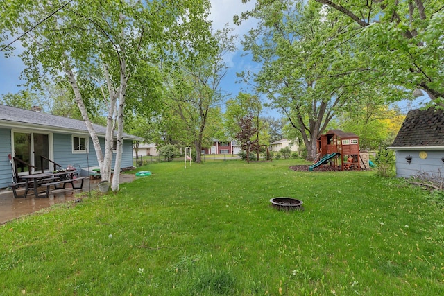 830 Halliday Rd, Saint Cloud, MN 56301 - view of yard with a playground, a patio, and an outdoor fire pit