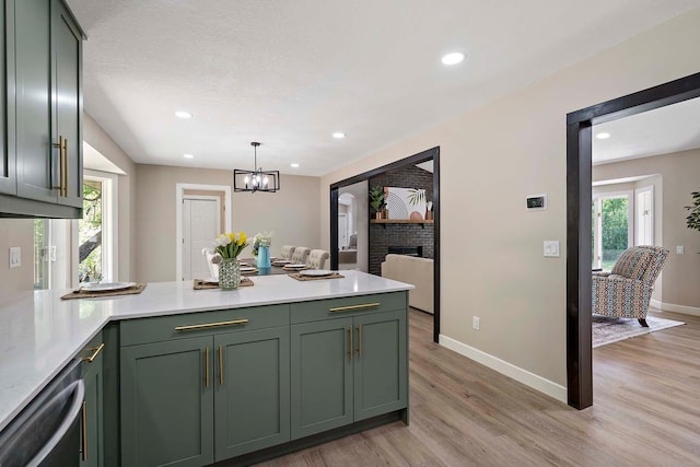 77 Emerson Ave W, West Saint Paul, MN 55118 - kitchen with green cabinets, a peninsula, light countertops, light wood-type flooring, and recessed lighting
