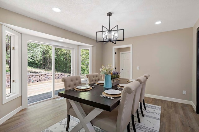 77 Emerson Ave W, West Saint Paul, MN 55118 - dining room featuring a chandelier, baseboards, light wood finished floors, and recessed lighting