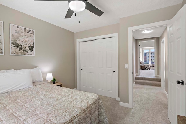 77 Emerson Ave W, West Saint Paul, MN 55118 - bedroom with light carpet, a closet, baseboards, and a ceiling fan